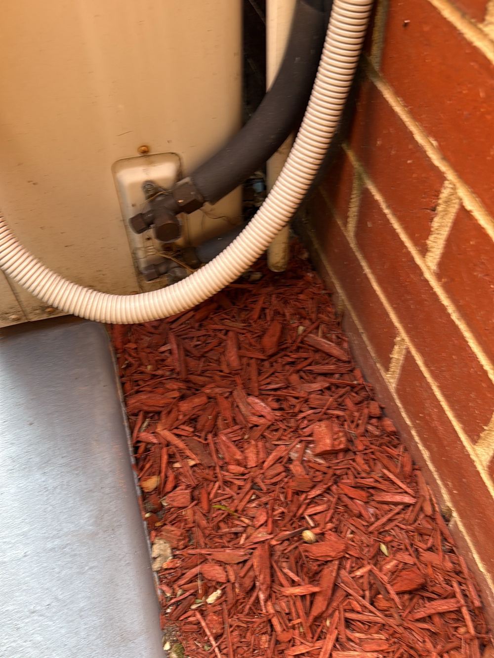 Air conditioner condensate running straight onto the ground, Newport, Mambourin