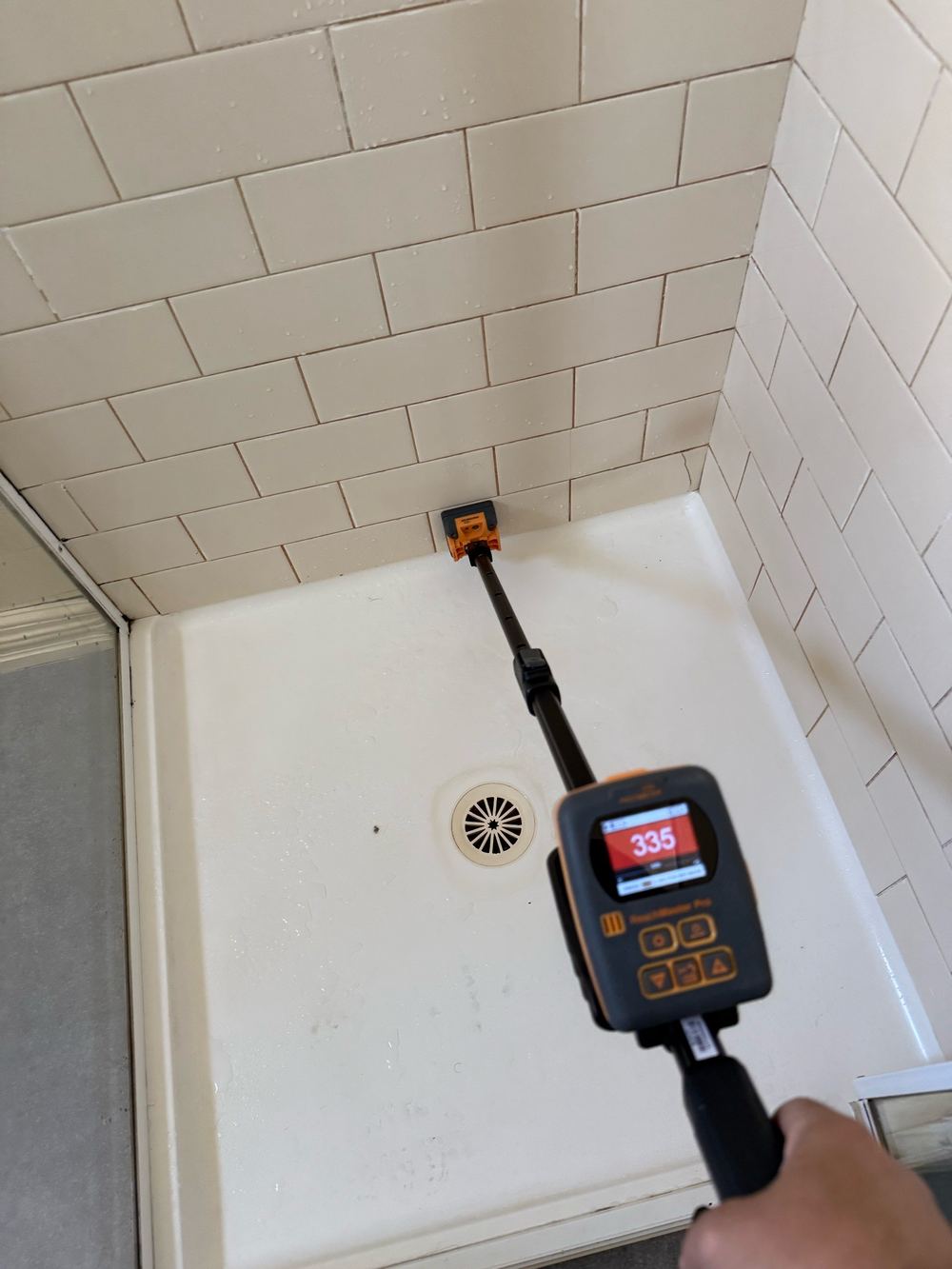 Elevated moisture detected behind the shower tiles, Newport, Mambourin