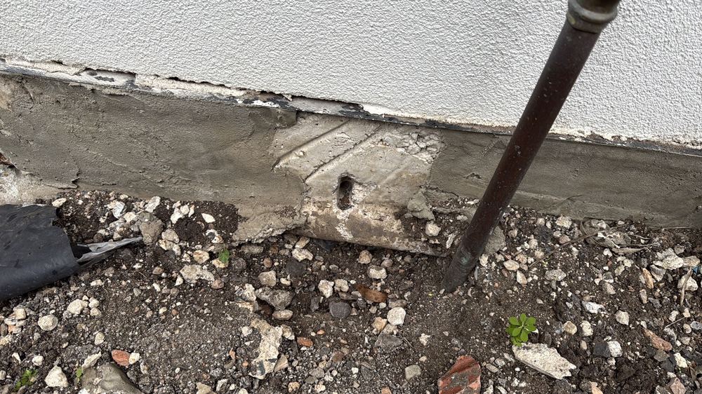 Rough concrete patch repair with reinforcement still exposed, Herne Hill, Mambourin