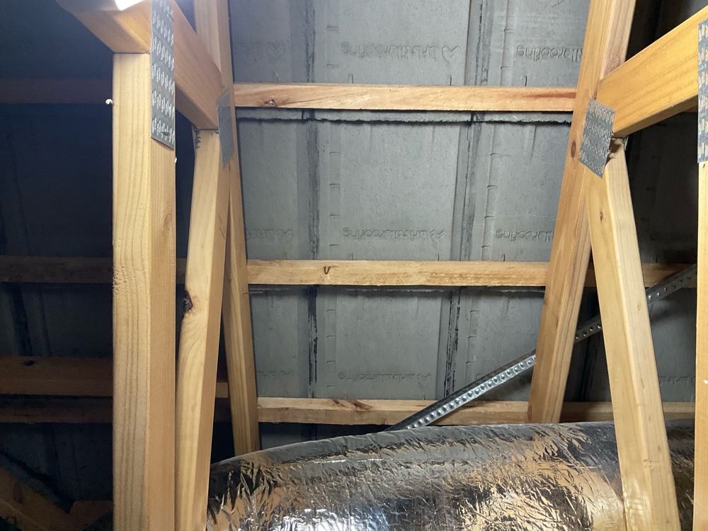 Sarking missing under the tiled roof where the drawings nominate it, found during a pre-handover inspection in Mambourin