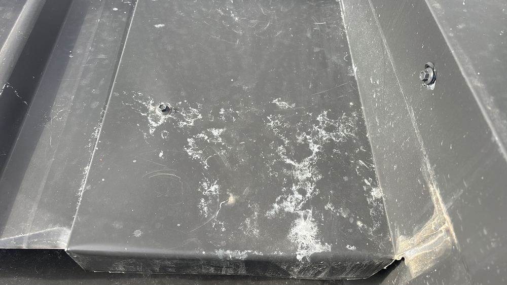 Dents and paint loss on the metal roof that can lead to corrosion, Mambourin