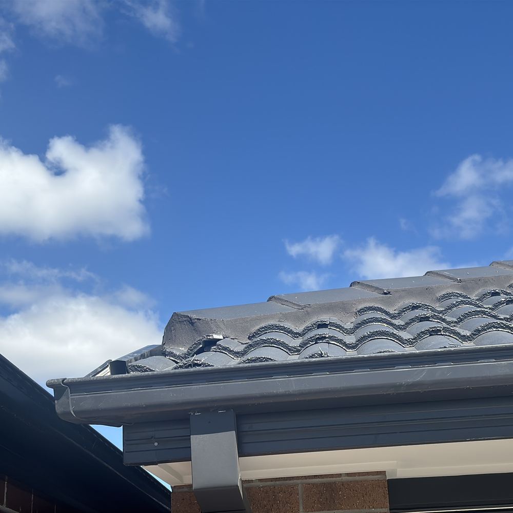 Roof tiles out of position and needing to be reset before they slip, Mambourin