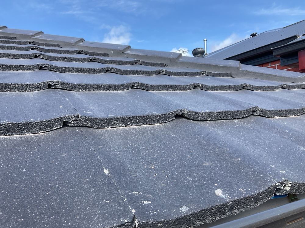 Broken tile underlaps across the roof, too many to list one by one, found during a pre-handover inspection in Mambourin