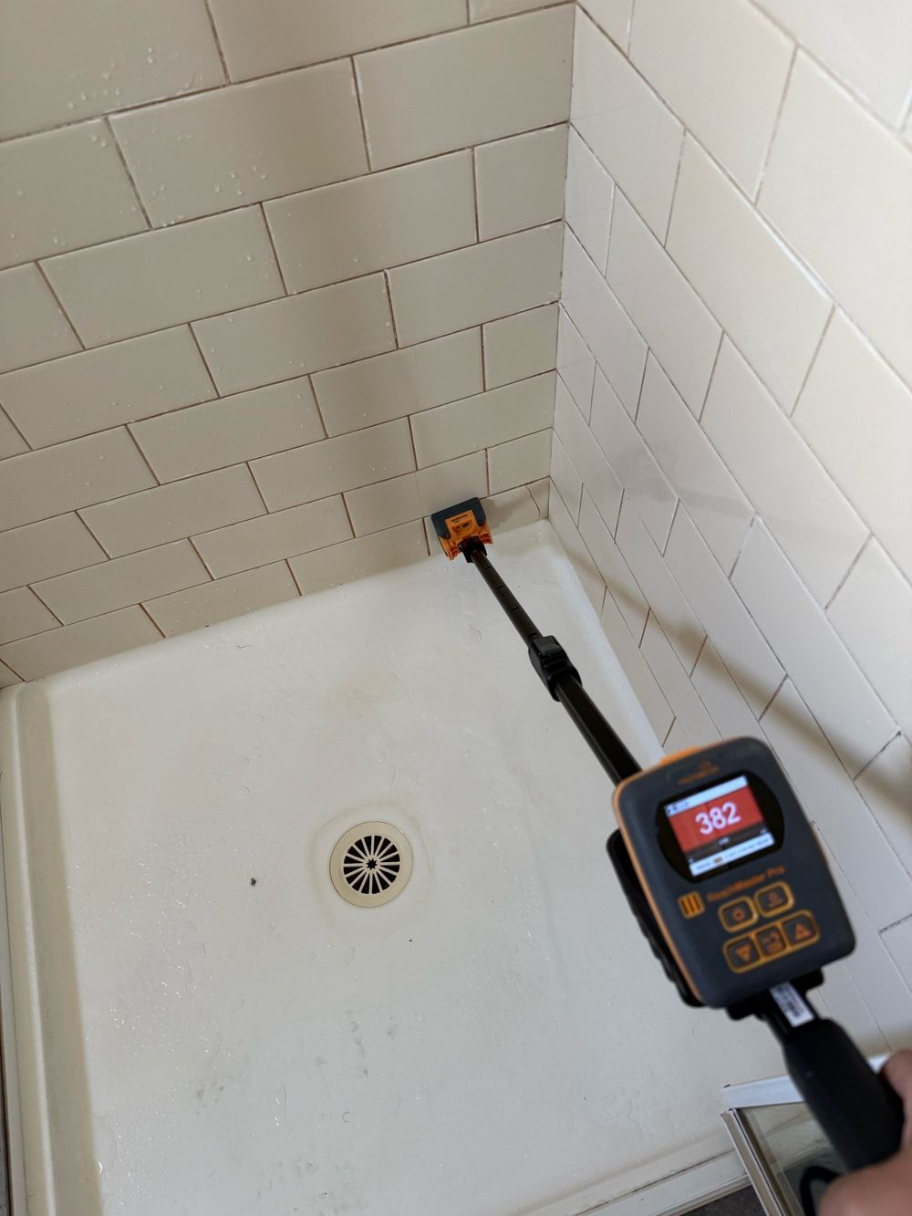Raised moisture readings under the shower tiles, Newport, Mambourin