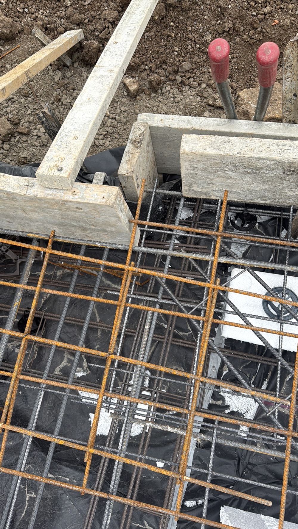 Steel sitting too close to the formwork, so concrete cover falls below the minimum, found during a slab pre-pour inspection in Mambourin